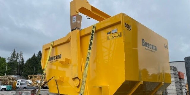 Bigfoot Crane Company A-600D Self-Dumping Bin by Boscaro on the back on a truck